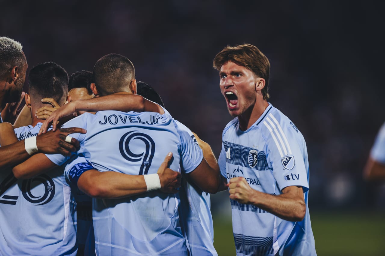 Sporting KC midfielder Jacob Bartlett celebrates after Sporting KC forward Erik Thommy scored the second goal against the Rapids