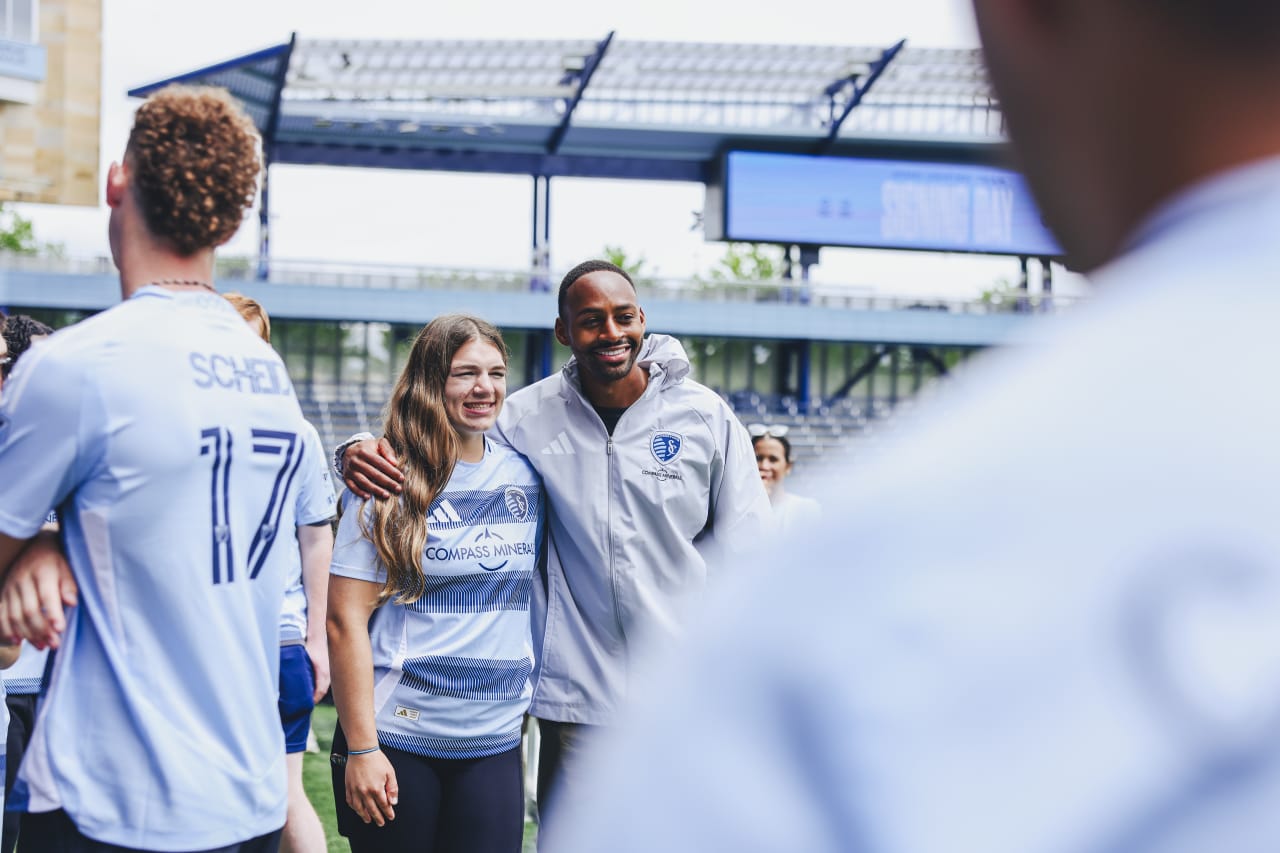 Unified player Helen Schmitt poses for a photo with Sporting KC forward Mason Toye