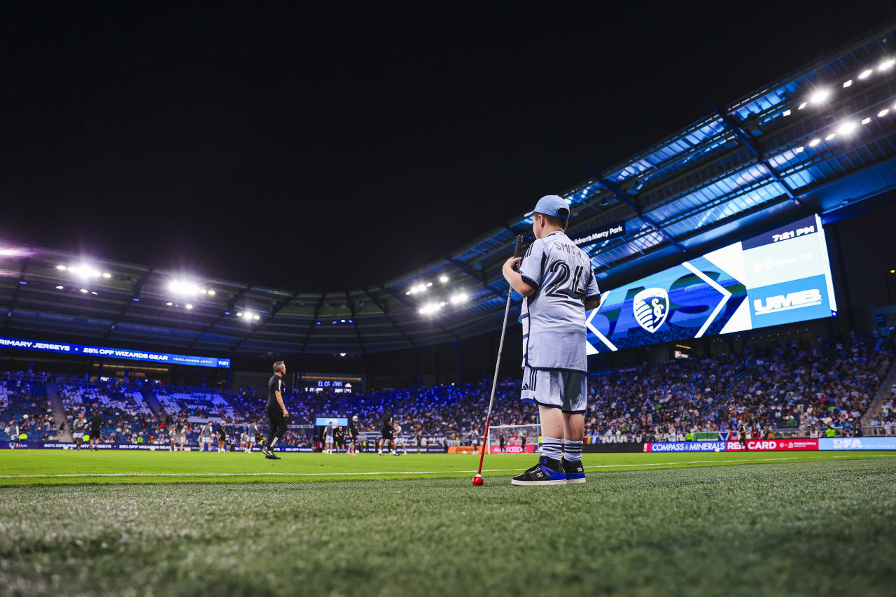 Miles eagerly waits his turn to take the pitch.