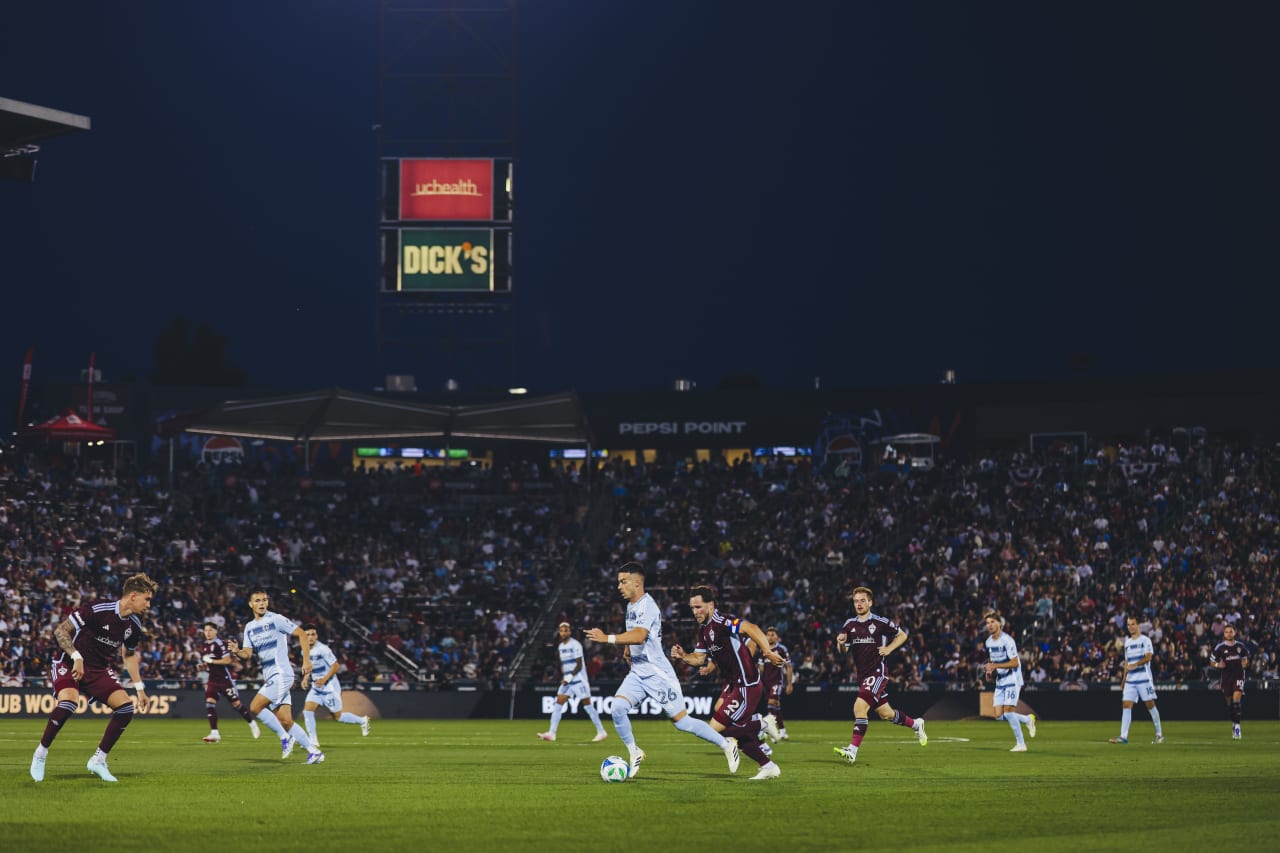 Sporting KC forward Erik Thommy dribbles the ball through defenders before scoring the second goal against Colorado