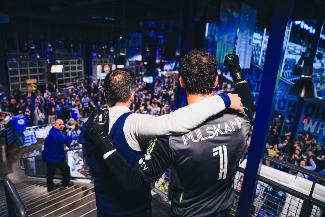 Sporting KC goalkeeper John Pulskamp and Interim Coach Kerry Zavagnin celebrate with fans in Budweiser Brewhouse after the game on Saturday vs St Louis