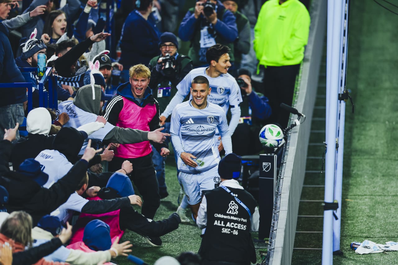 Sporting KC forward Dejan Jovelijic runs in front of the cauldron after scoring the first goal vs St. Louis.