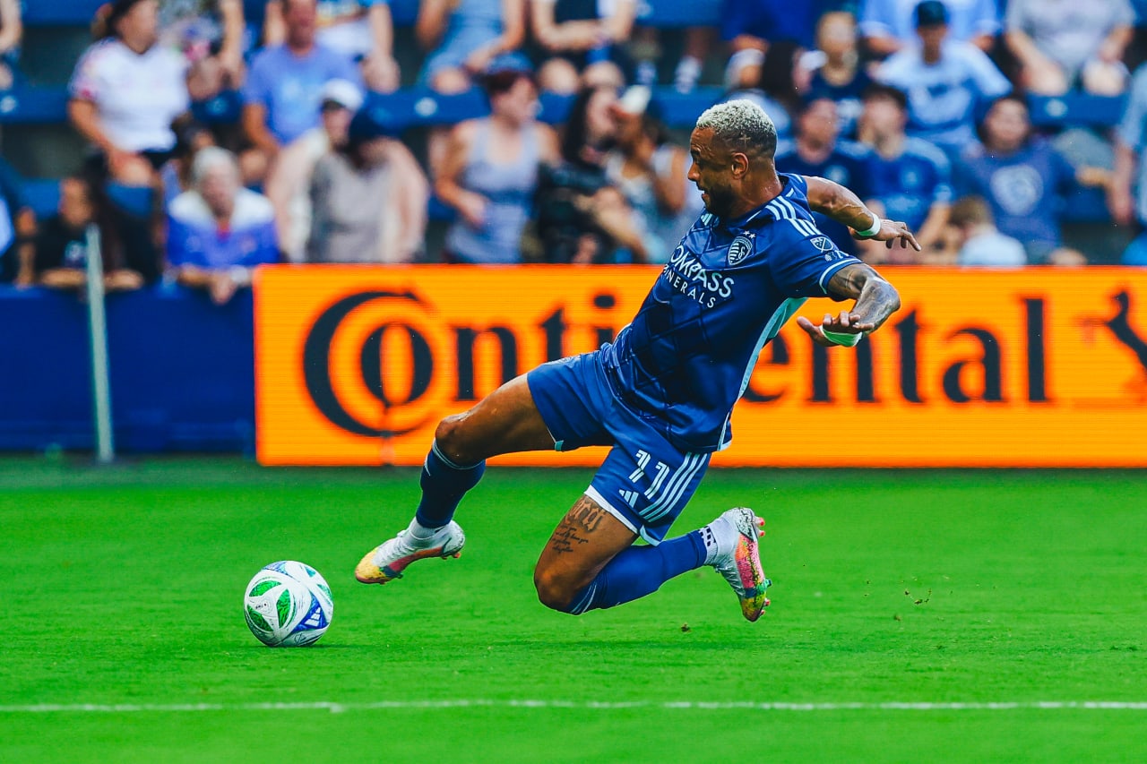 Sporting KC defender Khiry Shelton slides for the ball vs Salt Lake