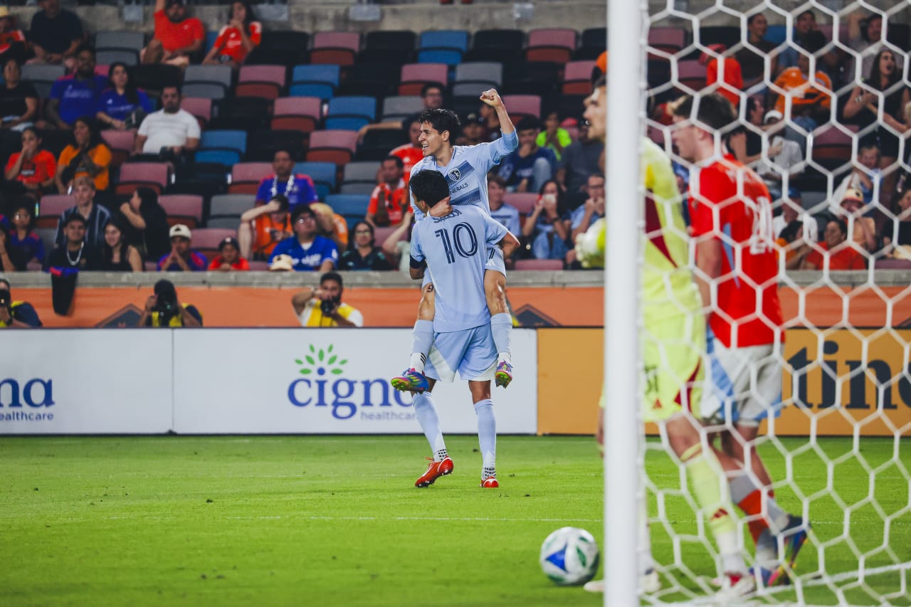 Sporting KC forward Santiago Munoz celebrates with forward Daniel Salloi after scoring his first goal with Sporting KC
