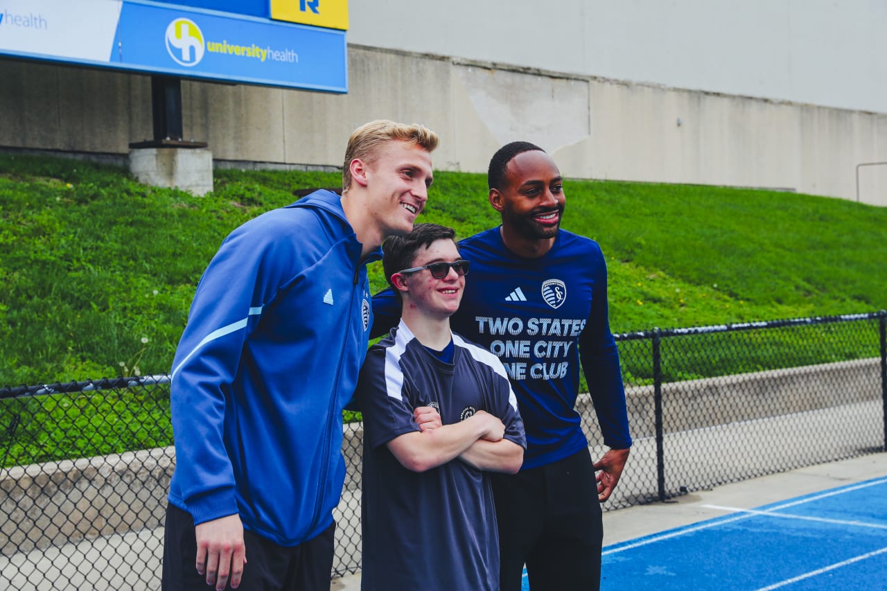 Team Ambassadors Ryan Schewe and Mason Toye take pictures with the athletes after tryouts.