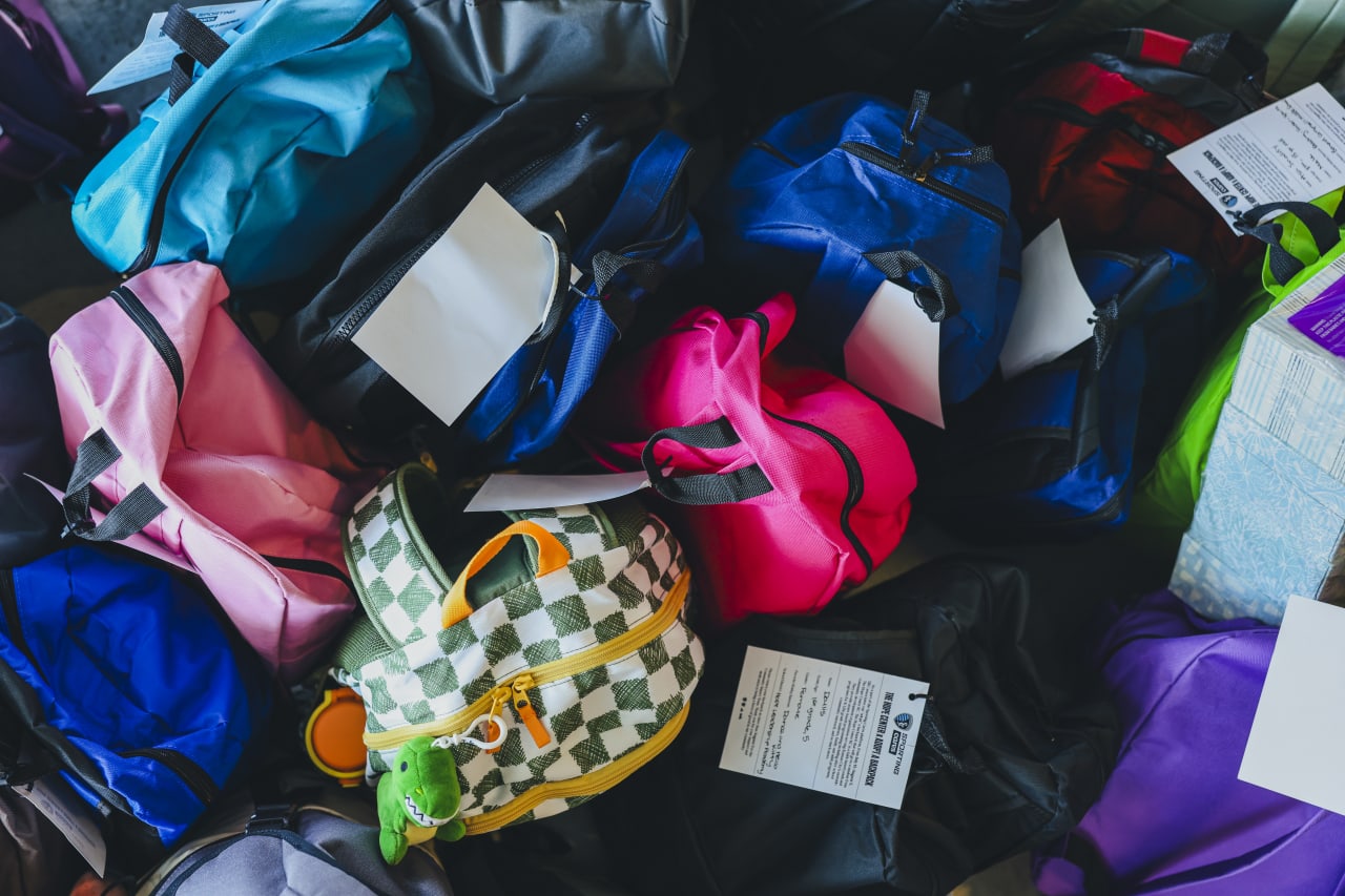 Sporting KC adopted a total of 75 backpacks, each personalized with a child's name, grade, interests, and a school supply list.