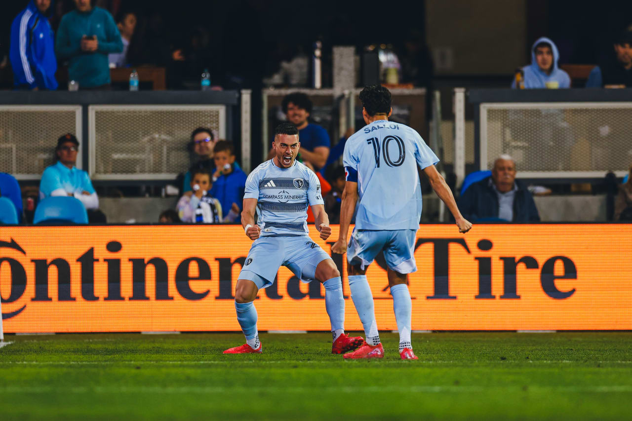 Sporting KC forward Erik Thommy celebrates with Sporting KC forward Daniel Salloi after providing the assist