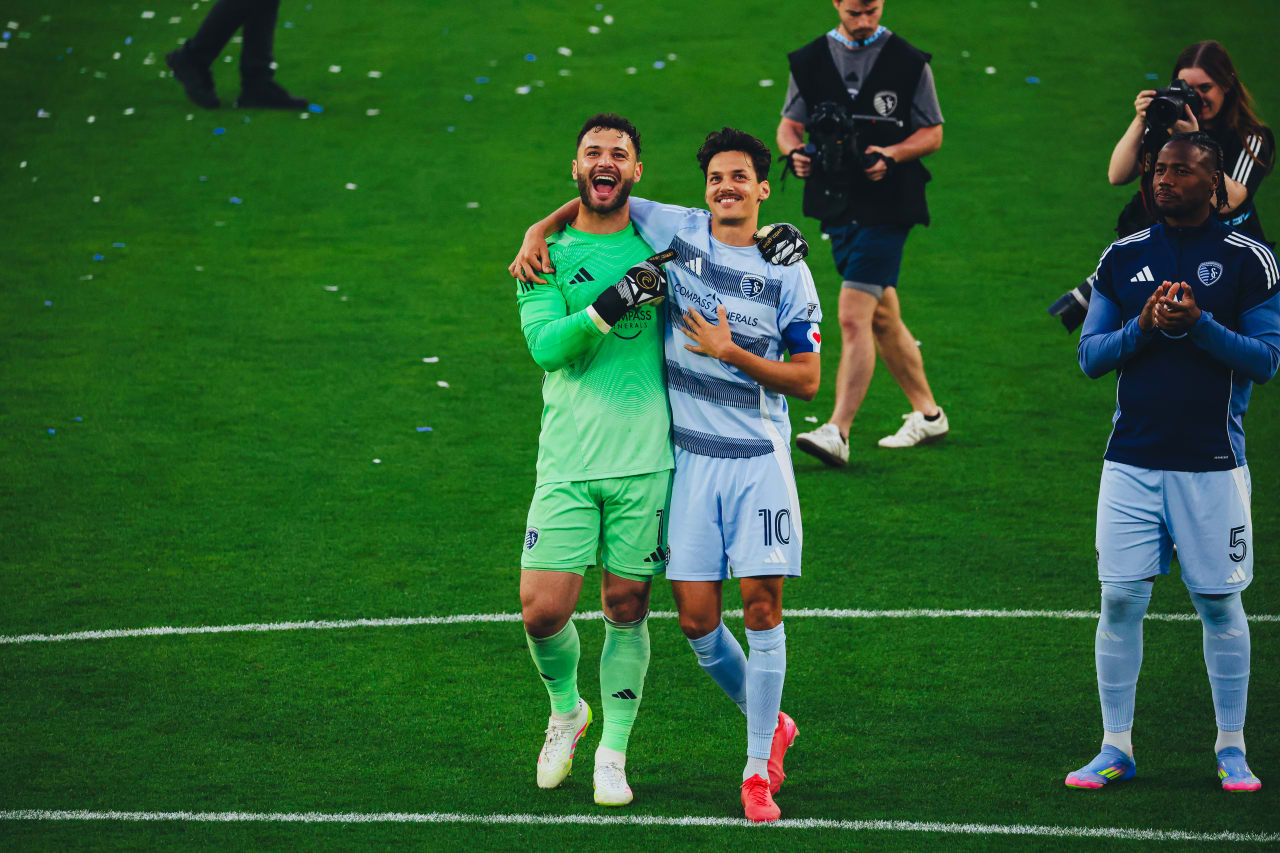 Sporting KC goalkeeper celebrates with Sporting KC forward Daniel Salloi after winning on Sunday.