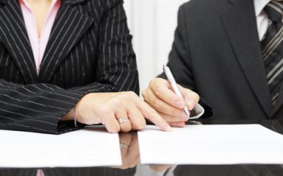 business woman  show a businessman  to sign a agreement